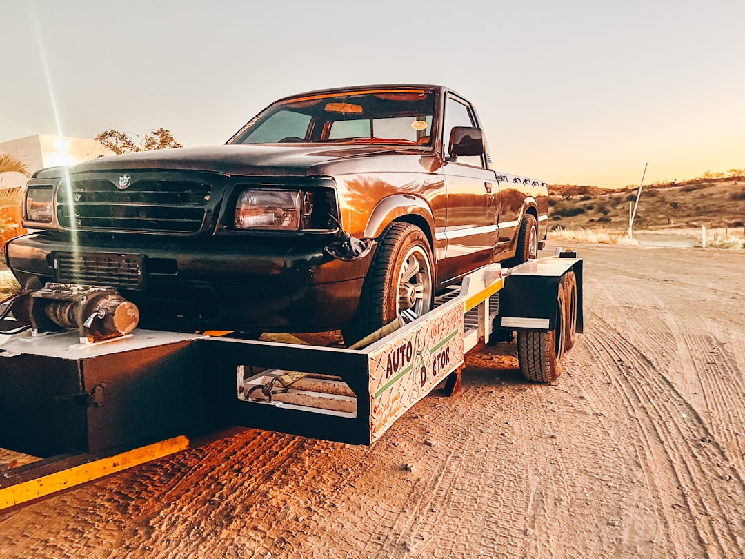 a-truck-is-being-towed-on-a-flatbed-trailer-jepqkaijobq
